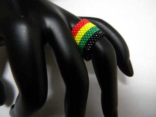 Beadweaved black red yellow and green unisex ring
